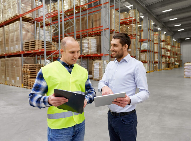 Men chatting in a warehouse about CPQ